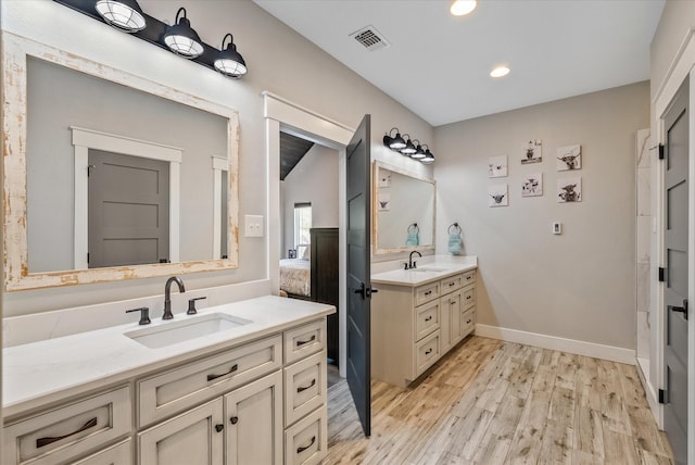 426 Vz County Road 2808, Mabank, TX 75147 - full bathroom with two vanities, wood finished floors, recessed lighting, and baseboards