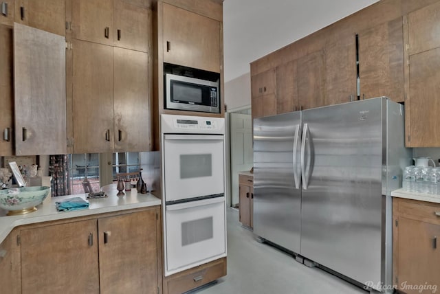 514 Pierremont Cir, Shreveport, LA 71106 - kitchen featuring appliances with stainless steel finishes, light countertops, and finished concrete flooring