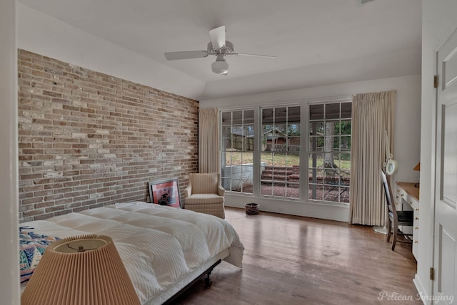 514 Pierremont Cir, Shreveport, LA 71106 - bedroom featuring brick wall, wood finished floors, and a ceiling fan