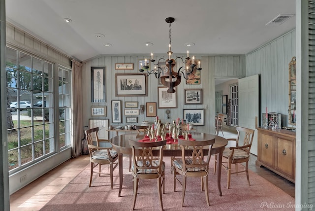 514 Pierremont Cir, Shreveport, LA 71106 - dining area with a chandelier, wood finished floors, vaulted ceiling, and ornamental molding