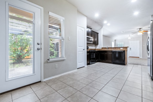 608 W Grove Cir, Anna, TX 75409 - kitchen with black appliances, light tile patterned flooring, a peninsula, a ceiling fan, and vaulted ceiling