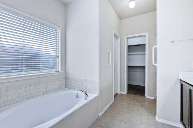 608 W Grove Cir, Anna, TX 75409 - bathroom with a bath, plenty of natural light, vanity, and baseboards