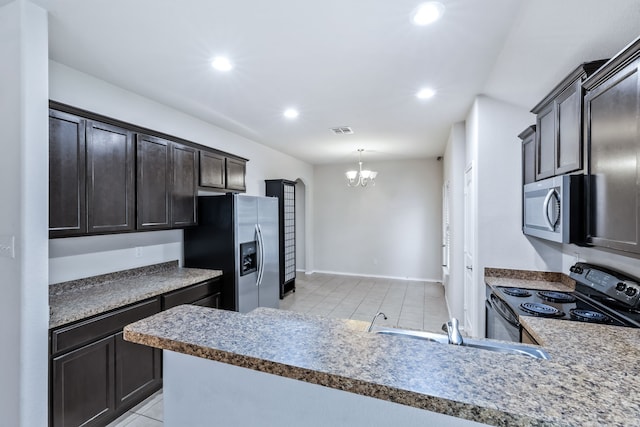 608 W Grove Cir, Anna, TX 75409 - kitchen with stainless steel appliances, a chandelier, recessed lighting, light tile patterned flooring, and a peninsula