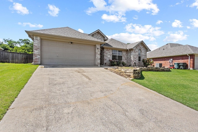 1716 Northbrook Ln, Sherman, TX 75092 - view of front of home featuring driveway, a garage, brick siding, and a shingled roof