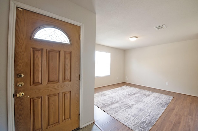 1446 Foxwood Ln, Rockwall, TX 75032 - entrance foyer featuring plenty of natural light and wood finished floors