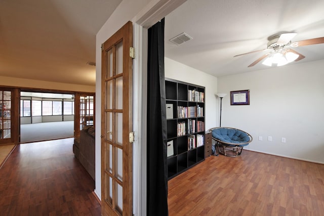 1446 Foxwood Ln, Rockwall, TX 75032 - hall with french doors, wood finished floors, and baseboards