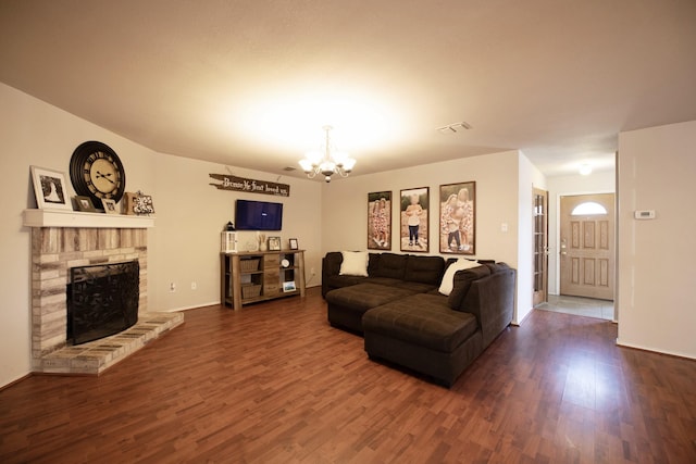 1446 Foxwood Ln, Rockwall, TX 75032 - living room featuring wood finished floors, a chandelier, a fireplace, and baseboards