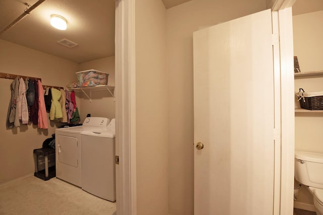 1446 Foxwood Ln, Rockwall, TX 75032 - laundry room featuring washing machine and dryer and light carpet