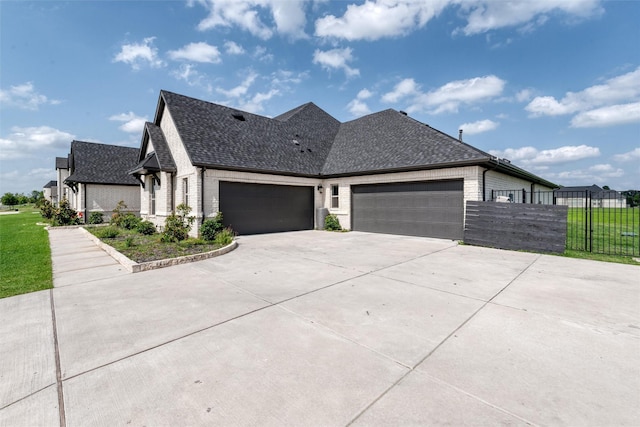 1230 Driftwood Ln, Lucas, TX 75002 - view of home's exterior featuring concrete driveway, an attached garage, a shingled roof, and brick siding