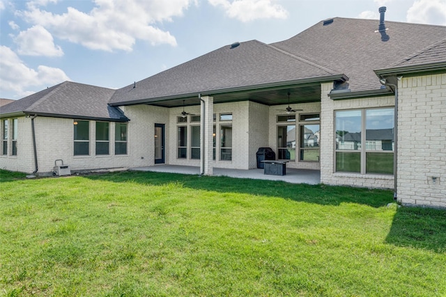 1230 Driftwood Ln, Lucas, TX 75002 - rear view of property featuring a ceiling fan, a patio, a shingled roof, brick siding, and a lawn