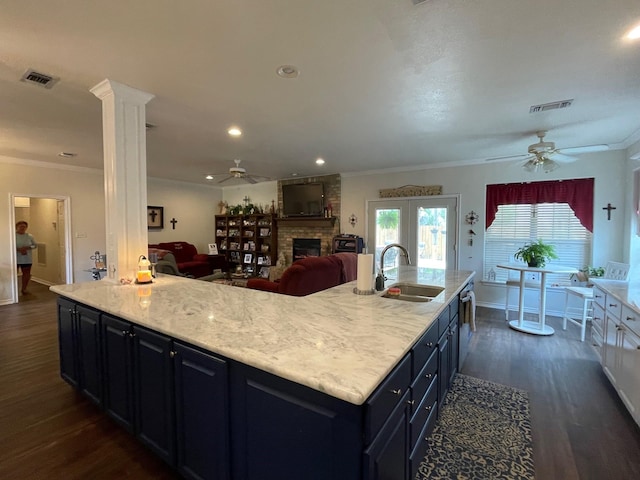 102 Dogwood Cir, Daingerfield, TX 75638 - kitchen featuring a sink, ceiling fan, ornamental molding, a fireplace, and dark wood finished floors