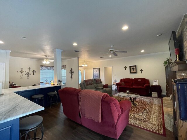 102 Dogwood Cir, Daingerfield, TX 75638 - living area featuring a ceiling fan, ornamental molding, dark wood-style flooring, recessed lighting, and decorative columns