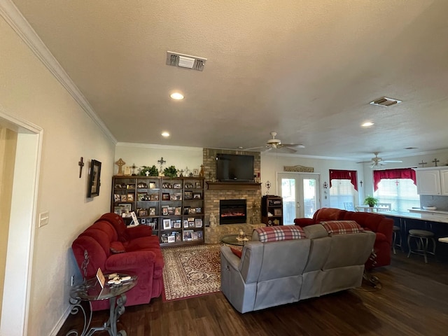 102 Dogwood Cir, Daingerfield, TX 75638 - living area featuring crown molding, ceiling fan, a fireplace, dark wood-style floors, and recessed lighting
