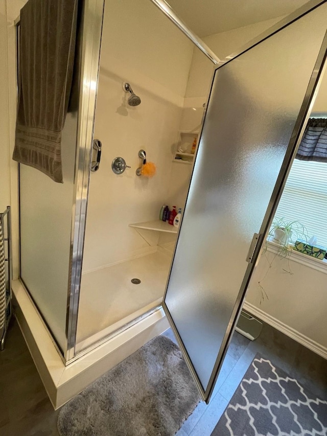 102 Dogwood Cir, Daingerfield, TX 75638 - bathroom with a stall shower and baseboards