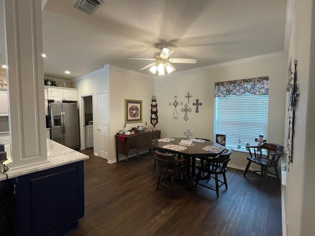 102 Dogwood Cir, Daingerfield, TX 75638 - dining area with ornamental molding, dark wood finished floors, ceiling fan, baseboards, and arched walkways