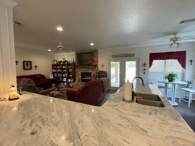 102 Dogwood Cir, Daingerfield, TX 75638 - living room with ceiling fan, a fireplace, recessed lighting, dark wood-style flooring, and crown molding