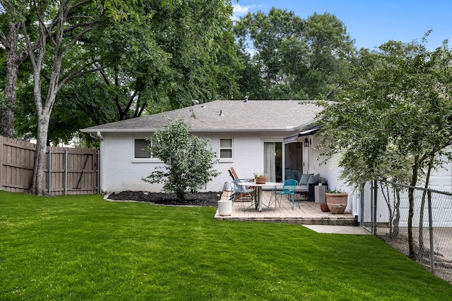 7805 Eagle Trl, Dallas, TX 75238 - rear view of property featuring a patio, a shingled roof, and brick siding