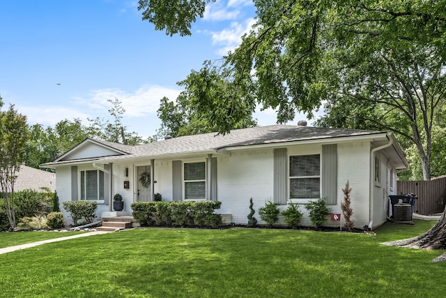 7805 Eagle Trl, Dallas, TX 75238 - ranch-style home featuring brick siding, a front yard, central AC, a porch, and a shingled roof