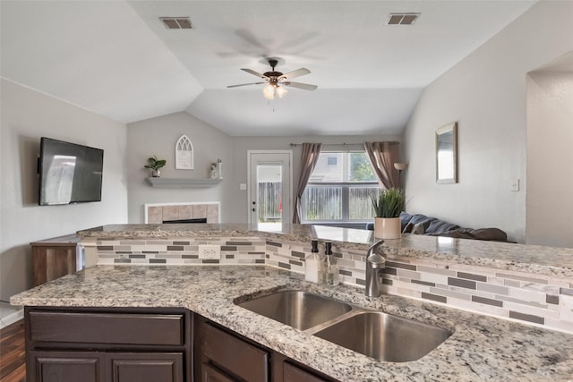 1433 Wind Dancer Trl, Fort Worth, TX 76131 - kitchen with open floor plan, lofted ceiling, a sink, ceiling fan, and dark brown cabinetry