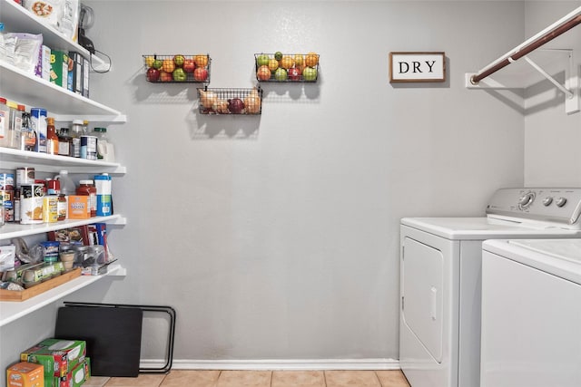1433 Wind Dancer Trl, Fort Worth, TX 76131 - laundry room featuring washer and dryer and light tile patterned floors
