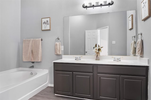 1433 Wind Dancer Trl, Fort Worth, TX 76131 - full bath with double vanity, a garden tub, and wood finished floors