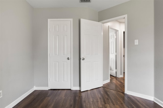 1433 Wind Dancer Trl, Fort Worth, TX 76131 - unfurnished bedroom featuring dark wood-style flooring and baseboards