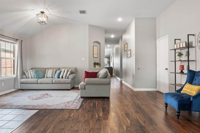 1433 Wind Dancer Trl, Fort Worth, TX 76131 - living room with wood finished floors, arched walkways, vaulted ceiling, and baseboards