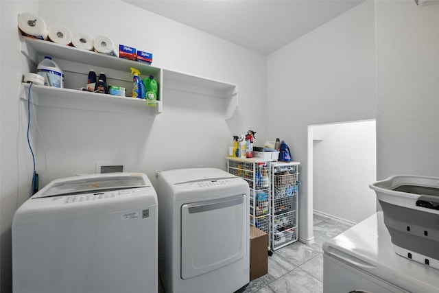11512 Starlight Ranch Trl, Fort Worth, TX 76052 - washroom with washer and dryer and light marble finish floors