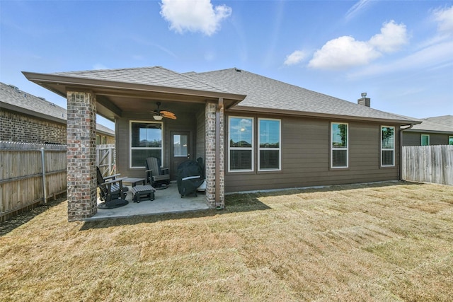11512 Starlight Ranch Trl, Fort Worth, TX 76052 - back of house featuring ceiling fan, a patio, a shingled roof, and a chimney