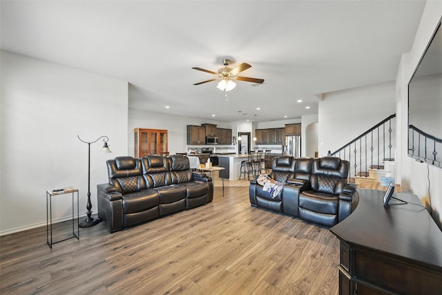 11512 Starlight Ranch Trl, Fort Worth, TX 76052 - living room with ceiling fan, stairway, light wood-style floors, recessed lighting, and baseboards