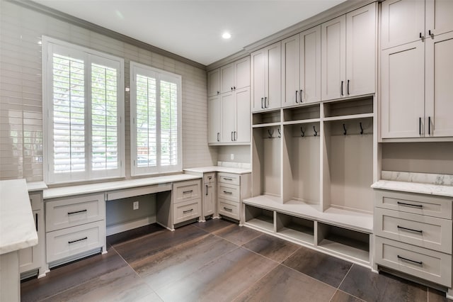 805 Cross Ln, Southlake, TX 76092 - mudroom with built in desk, crown molding, recessed lighting, and dark wood finished floors