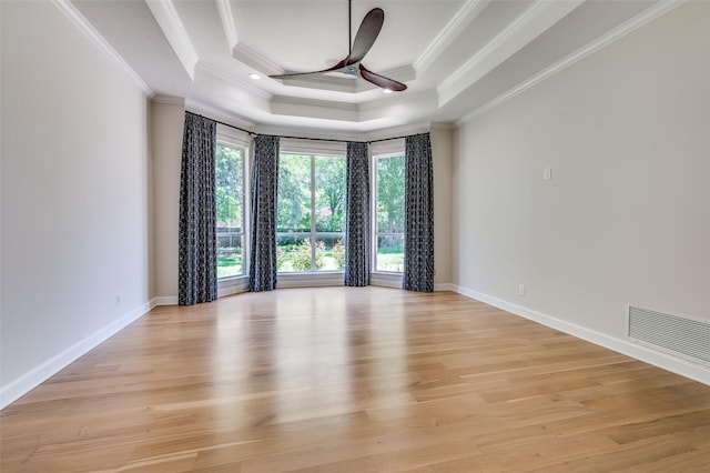 805 Cross Ln, Southlake, TX 76092 - empty room with ornamental molding, ceiling fan, a raised ceiling, light wood-type flooring, and baseboards