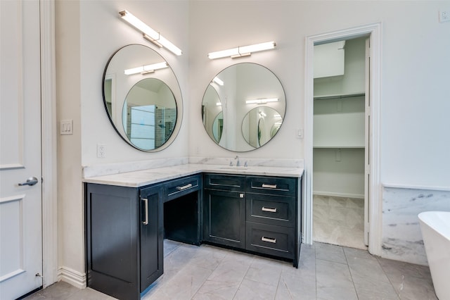 805 Cross Ln, Southlake, TX 76092 - full bathroom featuring vanity, a soaking tub, and a spacious closet