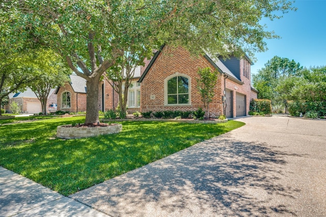 805 Cross Ln, Southlake, TX 76092 - english style home featuring a garage, brick siding, concrete driveway, and a front lawn