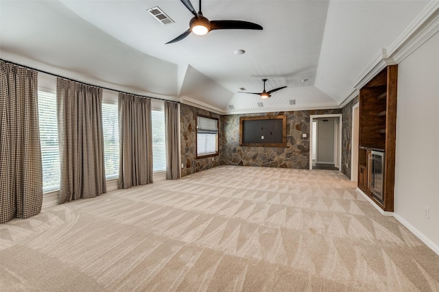 805 Cross Ln, Southlake, TX 76092 - unfurnished living room featuring a ceiling fan, light carpet, a fireplace, vaulted ceiling, and a raised ceiling