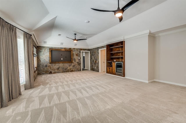 805 Cross Ln, Southlake, TX 76092 - unfurnished living room with ceiling fan, carpet flooring, a bar, vaulted ceiling, and crown molding