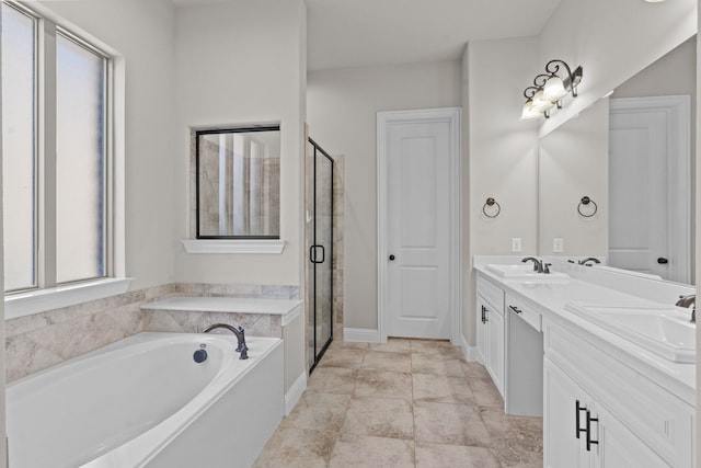 7913 Heritage Palms Trl, Mckinney, TX 75070 - bathroom featuring a garden tub, double vanity, and a stall shower