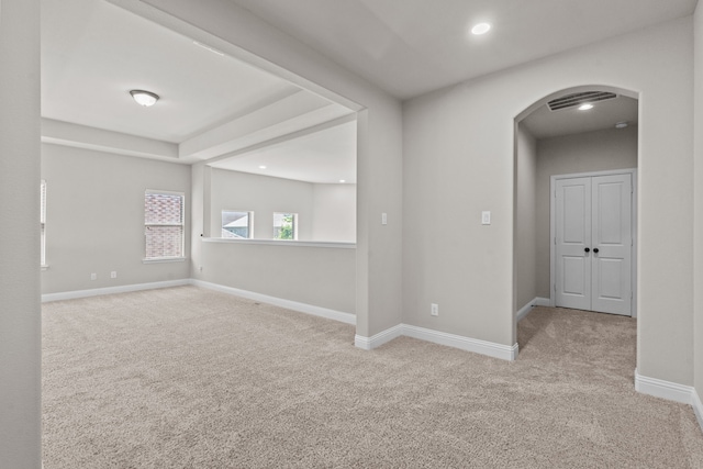 7913 Heritage Palms Trl, Mckinney, TX 75070 - empty room featuring arched walkways, carpet floors, baseboards, and recessed lighting