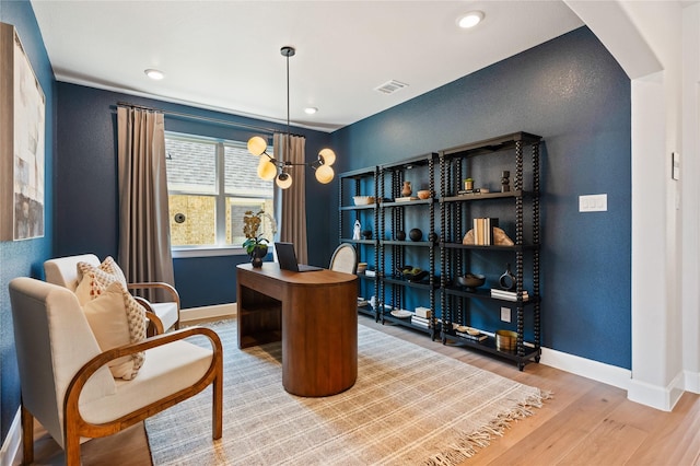 3105 Patrinia St, Royse City, TX 75189 - home office featuring arched walkways, wood finished floors, baseboards, a textured wall, and recessed lighting