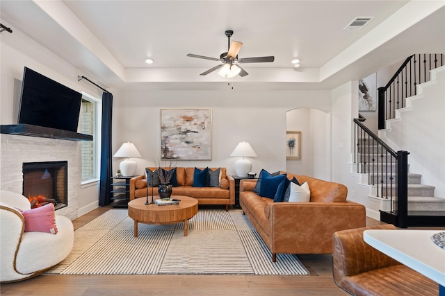 3105 Patrinia St, Royse City, TX 75189 - living area featuring ceiling fan, wood finished floors, stairway, arched walkways, and recessed lighting