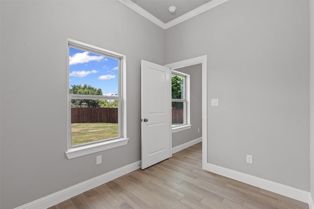 833 Haley, Springtown, TX 76082 - unfurnished room with baseboards, crown molding, light wood-style floors, and a smoke detector