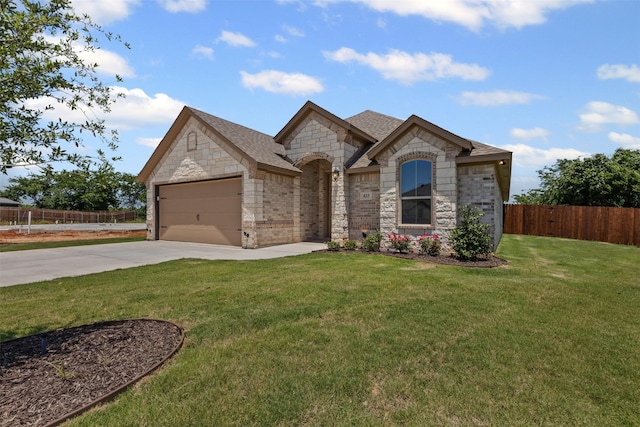 833 Haley, Springtown, TX 76082 - french country inspired facade featuring driveway, stone siding, a garage, and brick siding