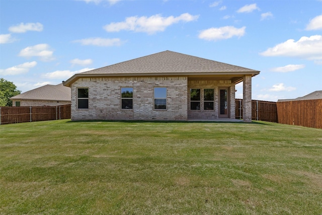 833 Haley, Springtown, TX 76082 - back of property featuring brick siding and roof with shingles