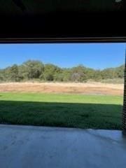 2076 Glenhollow Dr, Weatherford, TX 76088 - view of green lawn featuring a patio area