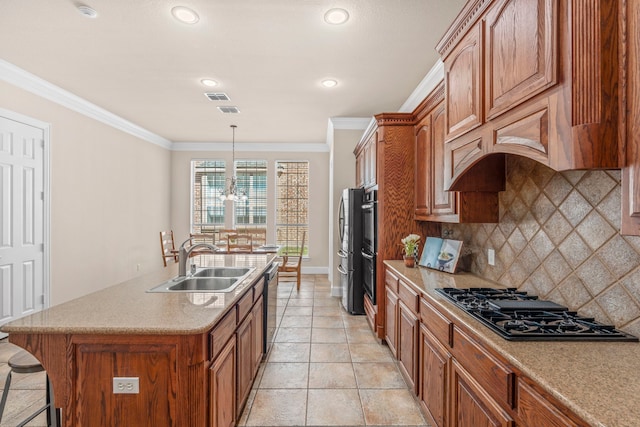 15372 Mountain View Ln, Frisco, TX 75035 - kitchen with black gas stovetop, a sink, tasteful backsplash, an island with sink, and crown molding