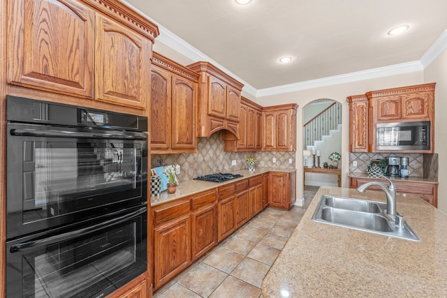 15372 Mountain View Ln, Frisco, TX 75035 - kitchen with a sink, black appliances, ornamental molding, decorative backsplash, and light countertops