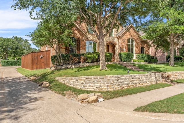 15372 Mountain View Ln, Frisco, TX 75035 - view of front of house featuring brick siding and a front lawn
