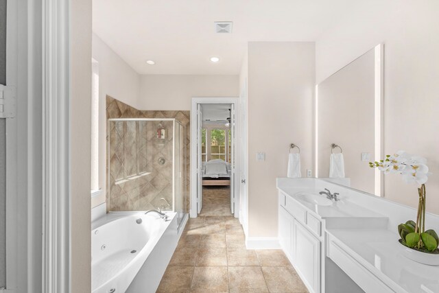 15372 Mountain View Ln, Frisco, TX 75035 - ensuite bathroom with vanity, a shower stall, a whirlpool tub, tile patterned floors, and baseboards