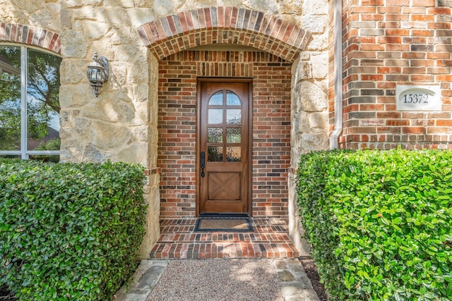 15372 Mountain View Ln, Frisco, TX 75035 - view of exterior entry featuring brick siding and stone siding