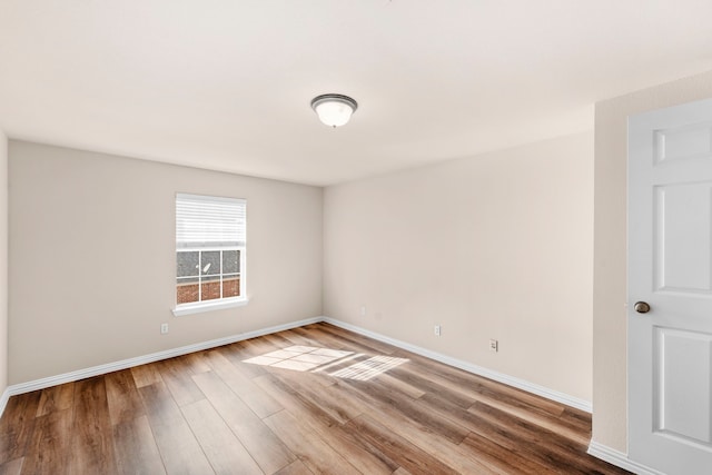 15372 Mountain View Ln, Frisco, TX 75035 - spare room featuring wood finished floors and baseboards